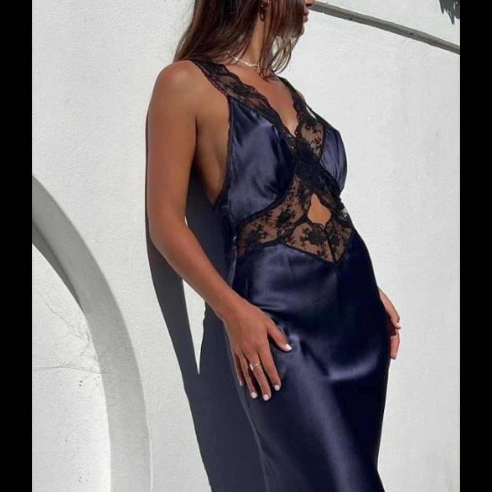 Stunning Sir. The label Aries dress in navy. 
100% silk
Size 4 US 10 
NWT